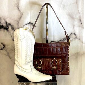 Michael Rome designs genuine embossed croc leather with stud detail